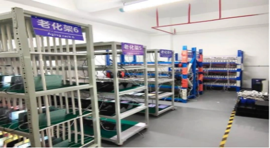 Products undergoing rigorous aging tests on dedicated burn-in racks to ensure long-term operational stability and zero-defect performance.