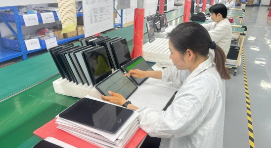 Engineer conducting rigorous software and firmware validation tests using advanced diagnostic equipment in a quality control laboratory.